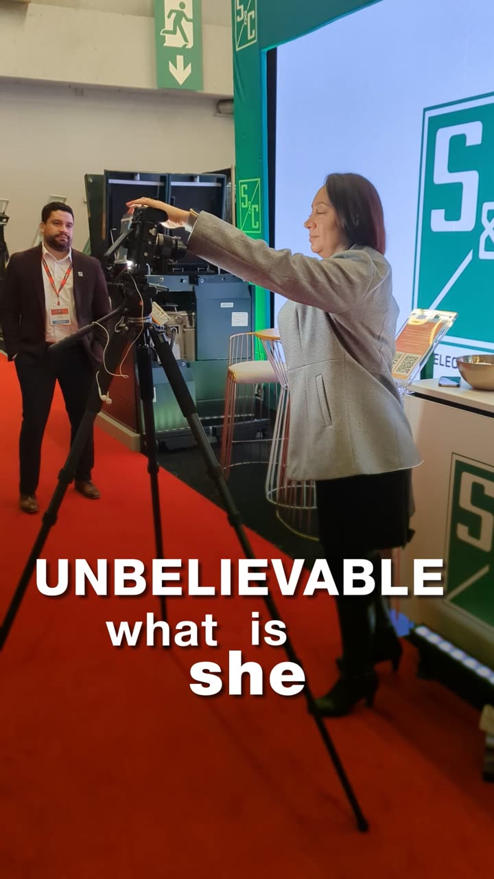 An S5L crew member setting a camera on its tripod, under the film&rsquo;s opening caption