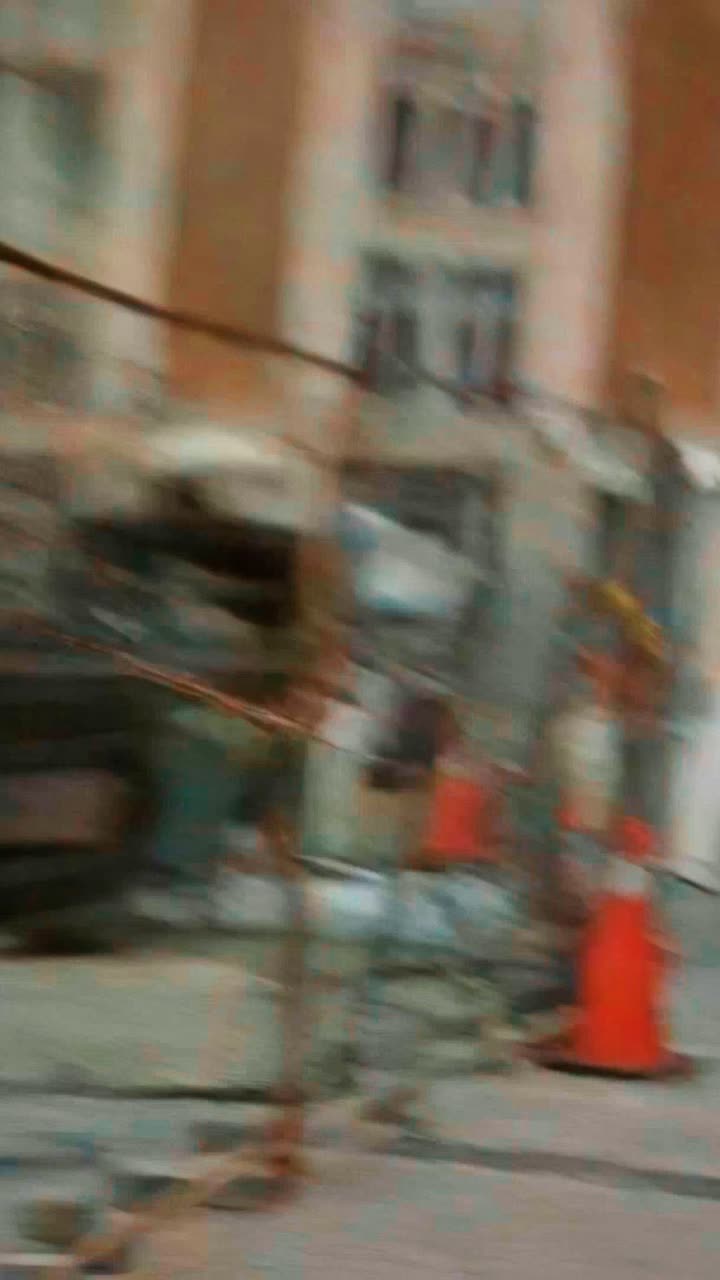 A downtown waterproofing site filmed from street level, on a Registon project