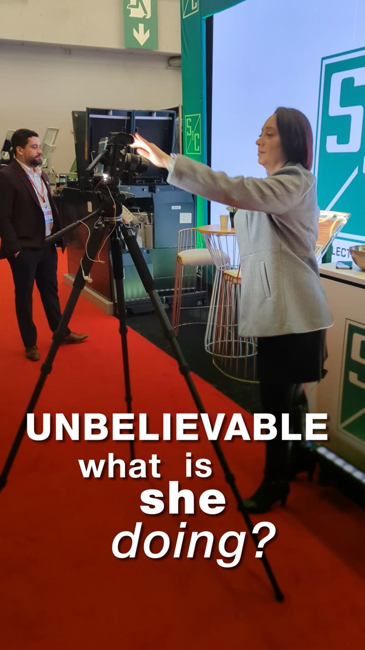 An S5L crew member setting a camera on its tripod on location, under the opening caption of the film