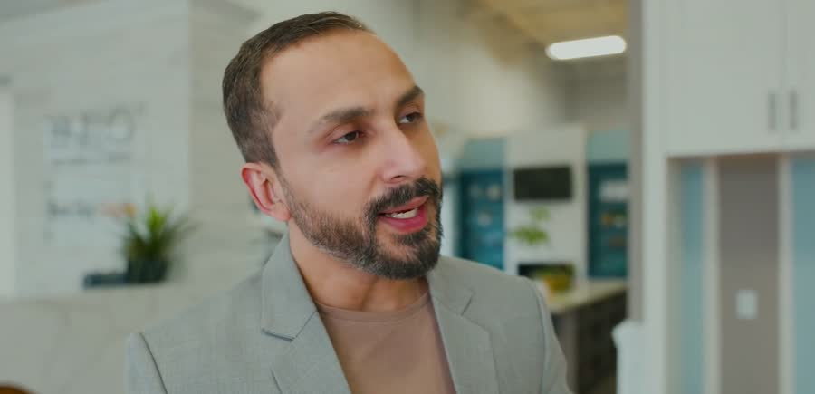 A company executive speaking on camera in his own office, filmed by S5L