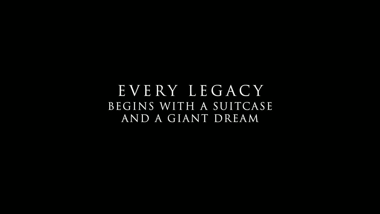 Title card reading Every legacy begins with a suitcase and a giant dream