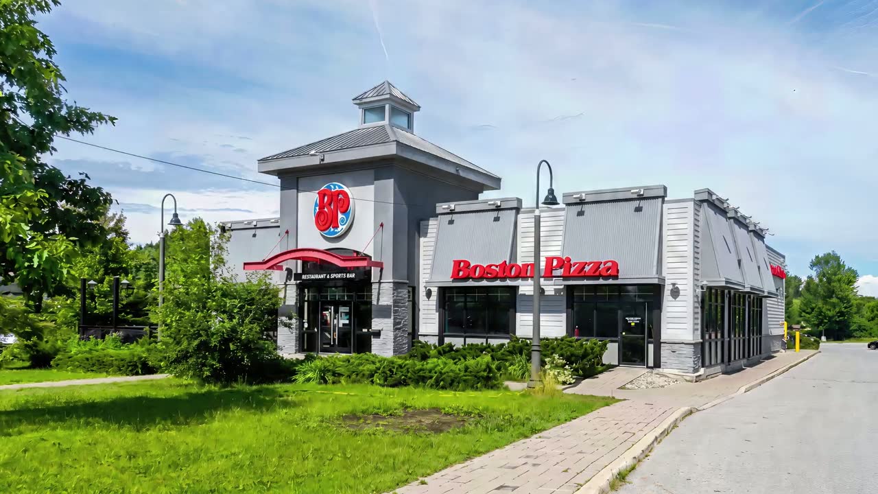 A completed Boston Pizza building shot from the street, one of Platinum's projects