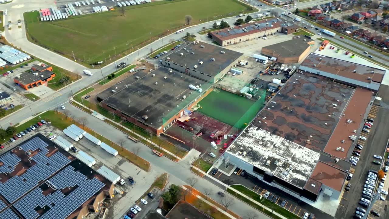 Aerial view of a large commercial roof, before the Seal Canada work